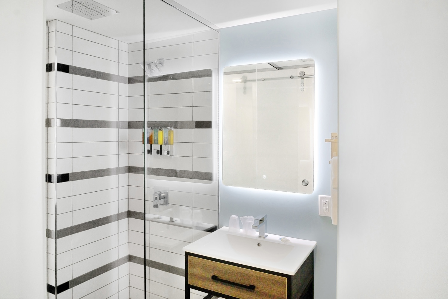 Bathroom with backlit mirror