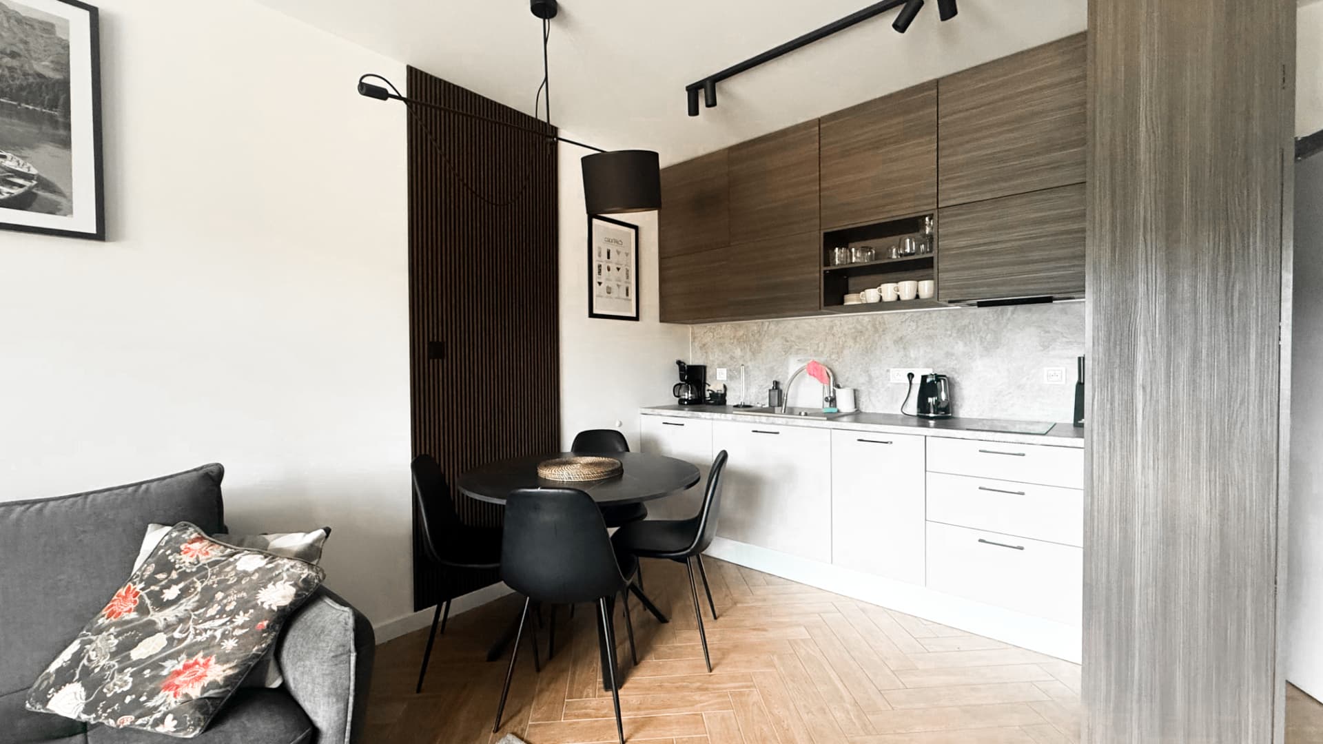 Open-plan apartment interior with a refined material palette